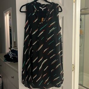 Black green red and cream dress